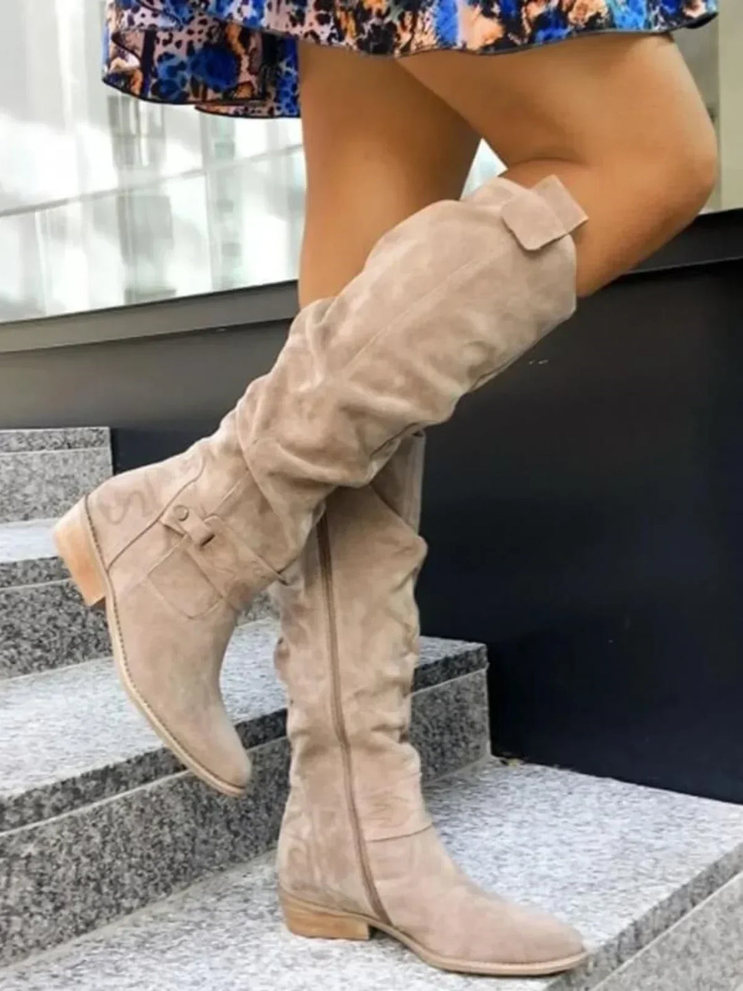 Elegant women’s over-the-knee boots with a low heel for autumn and everyday outfits