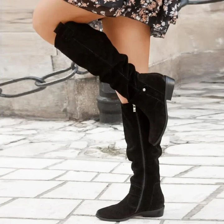 Elegant women’s over-the-knee boots with a low heel for autumn and everyday outfits