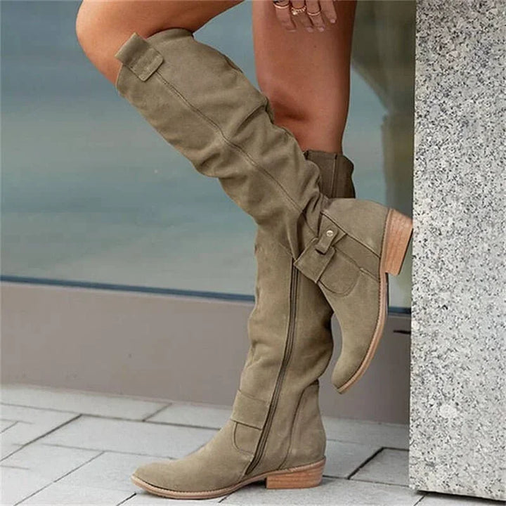 Elegant women’s over-the-knee boots with a low heel for autumn and everyday outfits