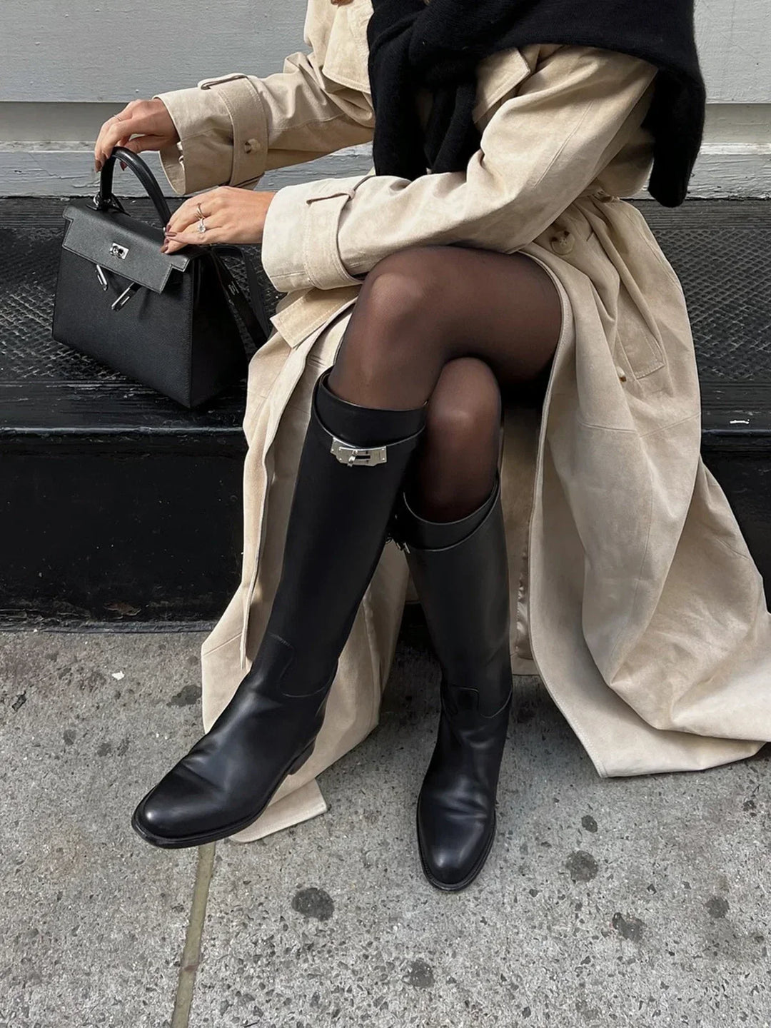 Women's autumn riding boots with decorative buckles and a comfortable insole