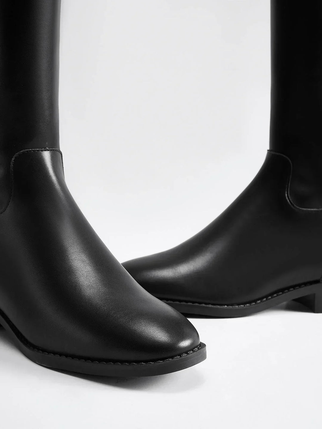 Women's autumn riding boots with decorative buckles and a comfortable insole