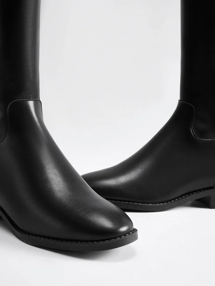Women's autumn riding boots with decorative buckles and a comfortable insole