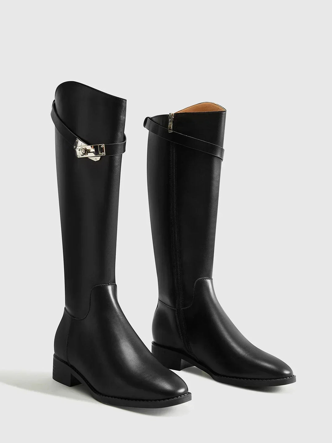 Women's autumn riding boots with decorative buckles and a comfortable insole