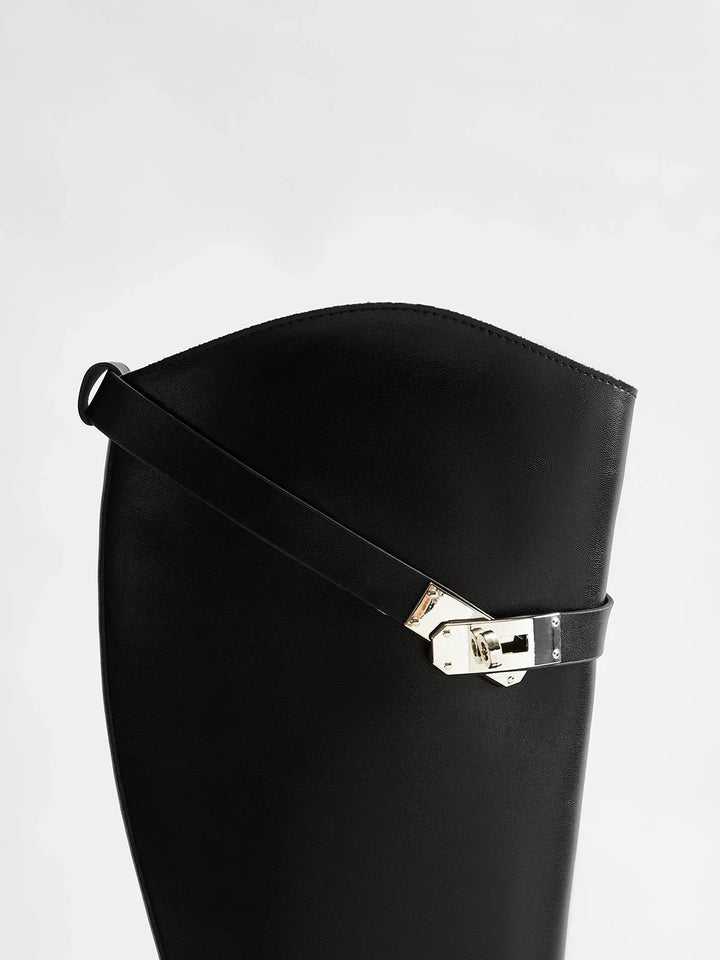 Women's autumn riding boots with decorative buckles and a comfortable insole